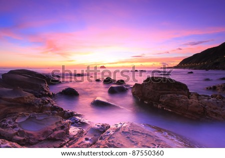 beautiful sun rise over the rocky coast