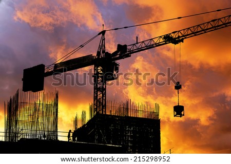 Construction site silhouette on sunset sky