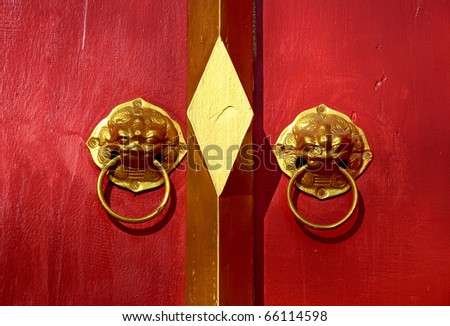 Red chinese door with a lion-singha head. Chinese New Year celebration at Thailand