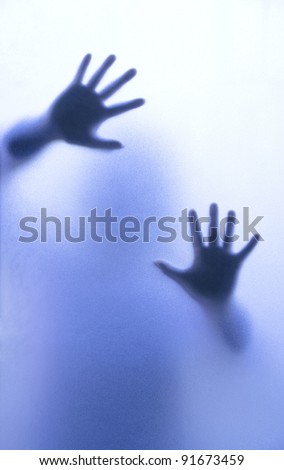 Silhouette of body through frosted glass for HELP.