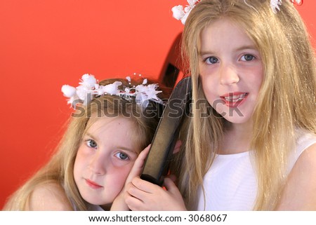 identical twin flower girls - funny face - Stock Image - Everypixel