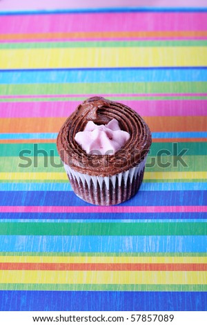 raspberry filled cupcake on colorful background