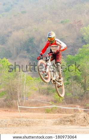CHAINAT, THAILAND - MARCH 8 : Unidentified biker riding a mountain bike at Thailand Championship 2014 Race 3 on March 8, 2014 in Chainat, Thailand.