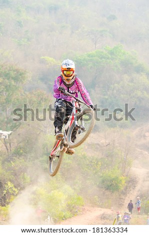 CHAINAT, THAILAND - MARCH 8 : Unidentified biker riding a mountain bike at Thailand Championship 2014 Race 3 on March 8, 2014 in Chainat, Thailand.