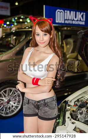 NONTHABURI - JUNE 24 : Unidentified model with modified car on display at Bangkok International Auto Salon 2015 is Exciting Modified Car Show on June 24, 2015 in Nonthaburi, Thailand.
