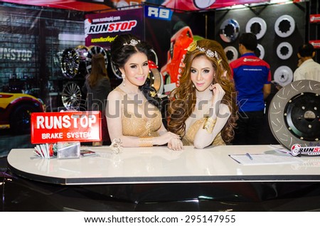 NONTHABURI - JUNE 24 : Unidentified model with modified car on display at Bangkok International Auto Salon 2015 is Exciting Modified Car Show on June 24, 2015 in Nonthaburi, Thailand.