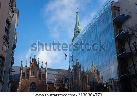 Similar – Image, Stock Photo Reflection of a church tower and houses in the water