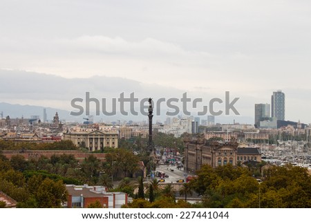 View of Columbus Monument and Barcelona city on a rainy day