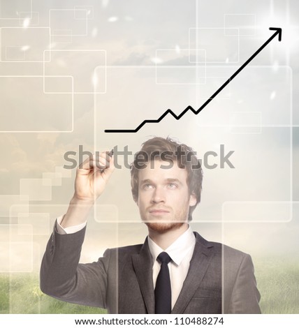 Businessman drawing a graph with black marker (growth)