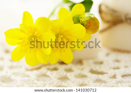 Yellow flowers with bars of soap on the cloth