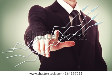 Businessman pointing arrows on vintage green background
