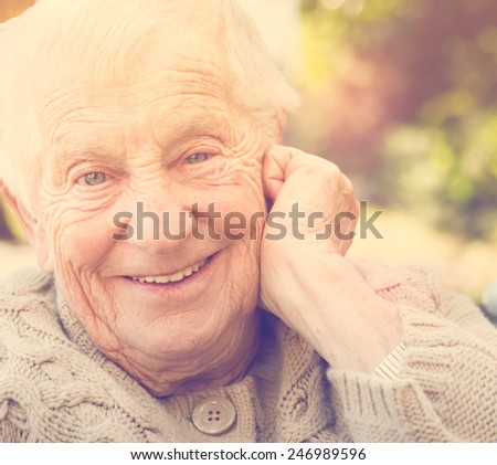 Senior woman with a big happy smile outside