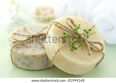 Bars of soap with bath salt and towels