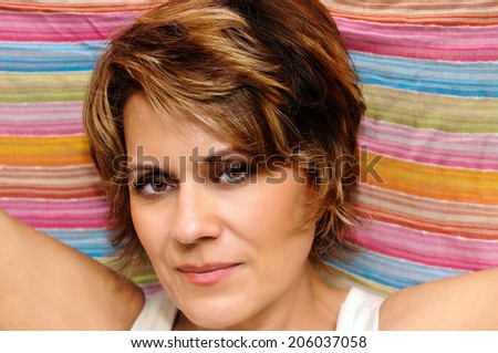 Mature Woman wrapped up in colorful fabric