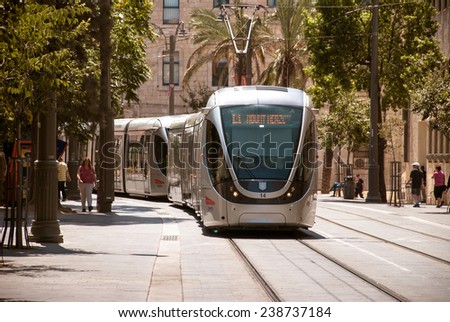 JERUSALEM, ISRAEL, CIRCA 2014. Tramway in the city center, new technology transportation with pedestrians on the street.