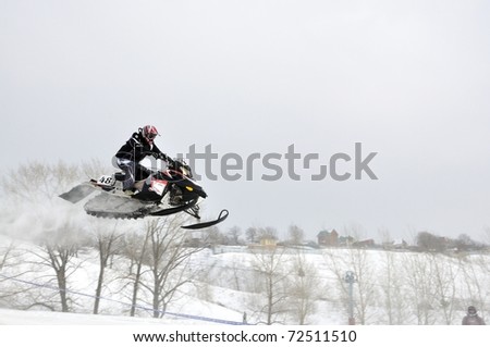 SAMARA, RUSSIA  - JANUARY 30: unidentified rider at the snow cross Russia Championship in Samara, Russia on January 30, 2011