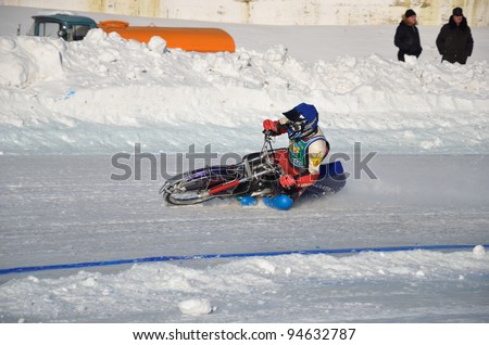 SAMARA, RUSSIA - JANUARY 29: Race the ice speedway on a motorcycle with spikes, the racer N. Ryabokon accelerates after the turn of, Ice Speedway Cup of Russia January 29, 2012 in Samara, Russia