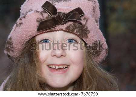 Adorable Young Girl in Pink Winter Hat