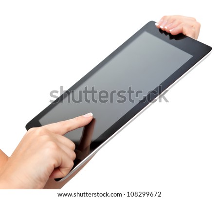 female hands holding a tablet touch pad computer gadget and touches the screen