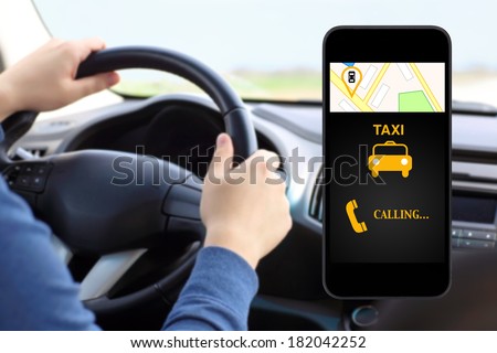 phone with interface taxi on a screen on a background man driving a car
