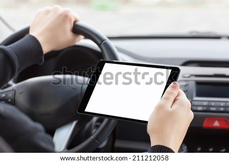 man sitting in the car and holding a touch tablet with isolated screen