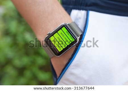 Alushta, Russia - September 3, 2015: Athlete hand with Apple Watch and app Workout on the screen. Apple Watch was created and developed by the Apple inc.