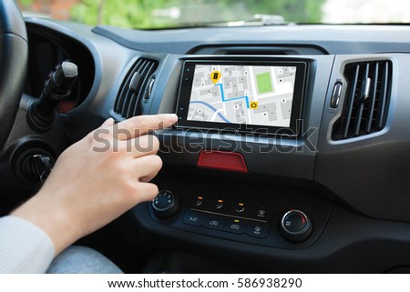 Man hand touching to screen multimedia system with  application navigation ストックフォト © 