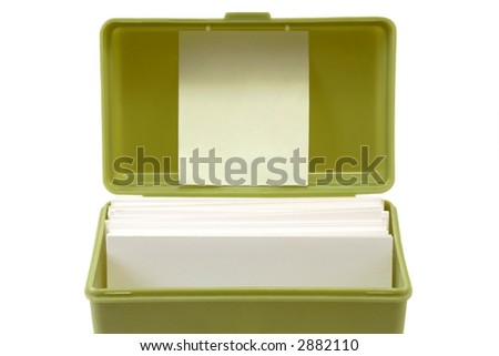 Index card file box with cards and yellow sticky note inside