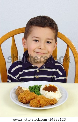 Boy and fried chicken dinner