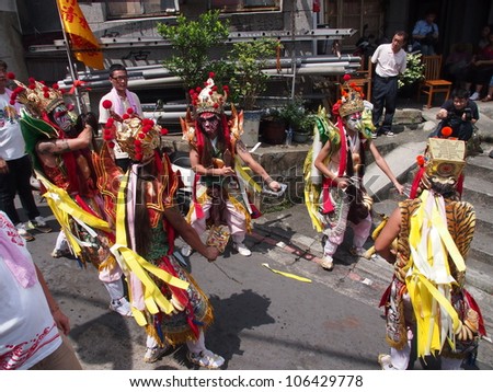 TAMSUI,TAIWAN- JUNE 24: The Eight Police Officers in tour of inspection for exorcism on June 24,2012 in Tamsui,Taipei,Taiwan. The fair held annually for honor of the Ching-Shui Master.