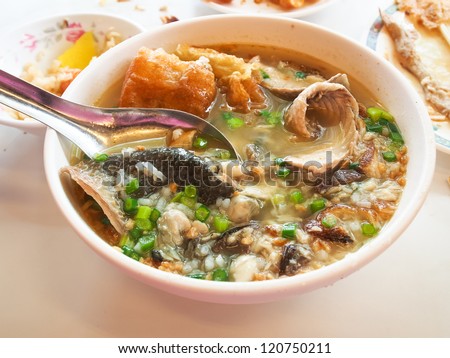 Taiwanese traditional food : milk-fish porridge with fried bread stick