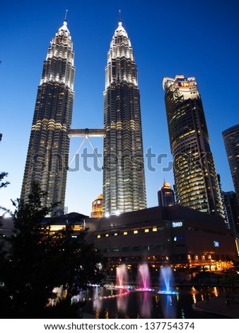 KUALA LUMPUR - APRIL 15: Petronas Twin Towers on April 15, 2013 in Kuala Lumpur. Petronas Twin Towers were the tallest buildings in the world from 1998 to 2004, but remain the tallest twin buildings