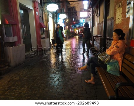 SHANGHAI , CHINA- MAY 18: People in Tianzifang on May 18, 2014. Tianzifang is an arts and crafts enclave that has developed from a renovated residential area in the French Concession area of Shanghai.