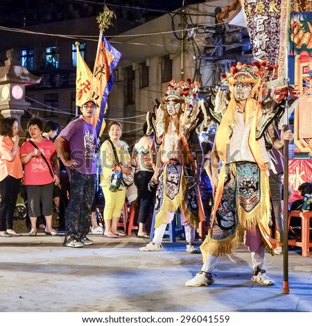 TAMSUI,TAIWAN- June 21:People dressed up statues of holy general in Culture Festival in night on June 21,2015 in Tamsui,Taipei,Taiwan. The fair held annually for honor of the Ching-Shui Master.