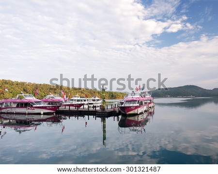 SUN MOON LAKE,TAIWAN - JUNE 7: many boats parking at the pier on June 7, 2015 at Sun Moon Lake, Taiwan. Sun Moon Lake is the largest body of water in Taiwan as well as a tourist attraction.