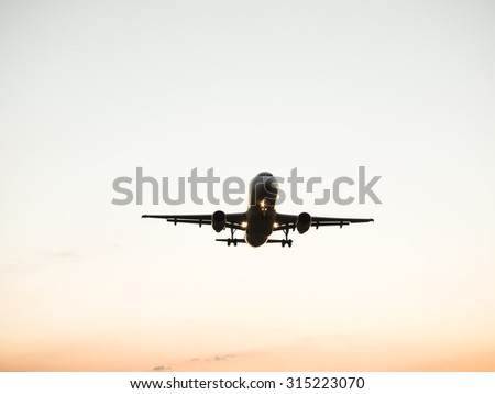 An airplane landing at an airport