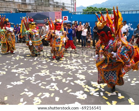 DANSHUI,TAIWAN - JUNE 23 : The Folk-Custom AcroBatics in the temple fair of  Danshui township on June 23,2010  in  Danshui,Taipei, Taiwan. The fair held   annually on Chinese Lunar date of sixth May.