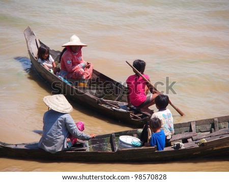 SIEM REAP, CAMBODIA-MAR 20: Cambodian people live beside Tonle Sap Lake in Siem Reap, Cambodia on March 20, 2012. Tonle Sap is the largest freshwater lake in SE Asia peaking at 16k km2
