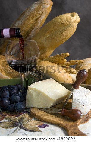 Assorted Breads and cheese and a glass of Chianti Wine