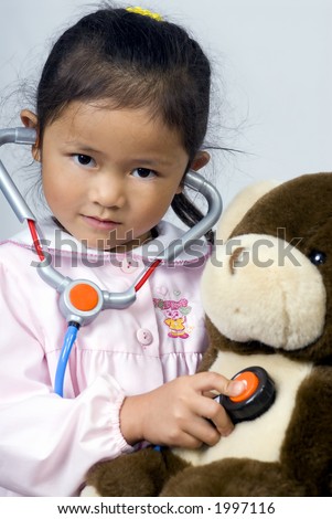 A young girl cares for her sick bear