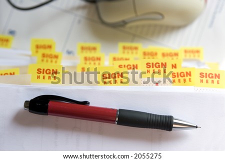 A pile of paperwork requiring signatures