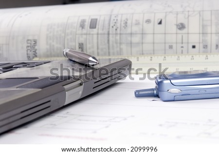 An Engineer\'s tools of the trade are laid out on a desktop