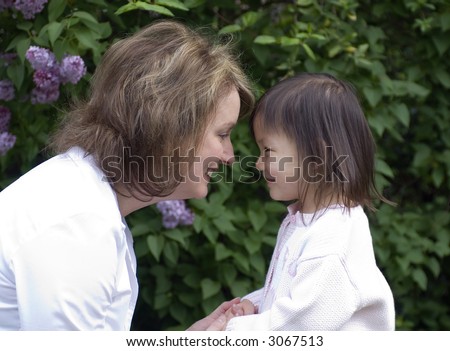 A mother and her adopted girl. Love affection bonding family