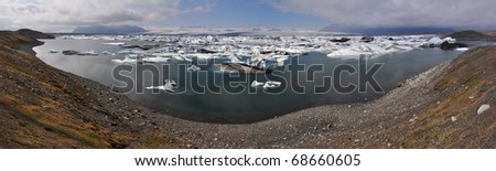 Panorama of floating icebergs in Glacial lagoon Jokullsarlon, Iceland