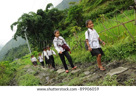 DARJEELING, INDIA - OCTOBER 27: Small unidentified children go home from school in Darjeeling on October 27, 2010. Education has been made free for children for 6 to 14 years of age in India.
