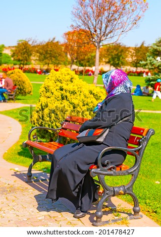 ISTANBUL, TURKEY - MAY 18 : Panorama 1453 area on May 18, 2013 in Istanbul, Turkey. A muslin wooman with traditional dress resting in the park.