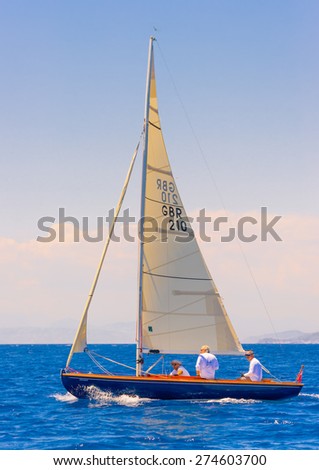 SPETSES, GREECE - JUN 21, 2014: Unidentified people on a Classic wooden sailing boat during a regatta in Spetses island in Greece on Jun 21, 2014