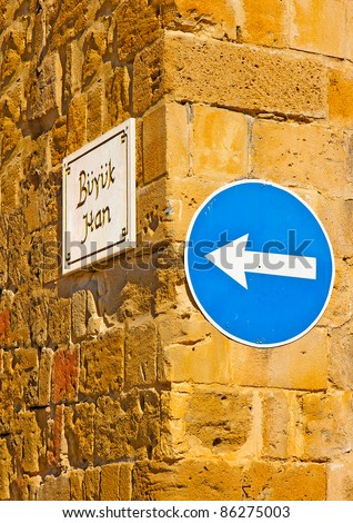 One way sign post on the corner of an old building located in Nicosia Cyprus