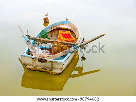 Traditional old wooden fishing boat in the lake Orestiada in Kastoria city of northern Greece