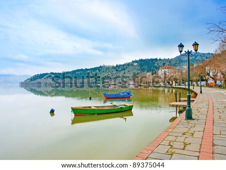 traditional old wooden fishing boats in the lake Orestiada in Kastoria city of northern Greece